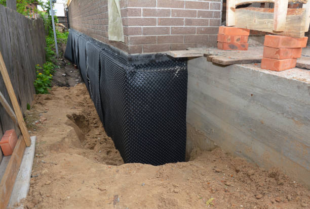 Happy homeowners after waterproofing job in Riga